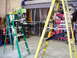 1979 Ford Bronco - A workshop scene with ladders and automotive parts, not a 1979 Ford Bronco.