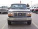 1995 Ford Bronco - This 1995 Ford Bronco is shown from the front, with a chrome grille and headlights visible.