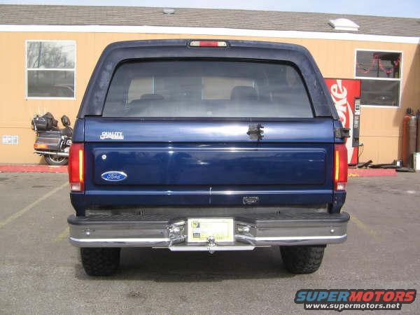 1995 Ford Bronco rear view, blue paint, chrome bumper, license plate