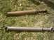 1990 Chevrolet Blazer - Two driveshafts are shown on the grass, one appears older and rusted.