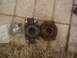 1990 Chevrolet Blazer - Two driveshaft yokes and a bearing assembly are laid out on the ground.