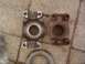 1990 Chevrolet Blazer - Comparison of a new and an old drive shaft yoke, laid out on a concrete surface.