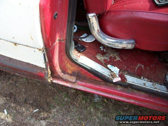 Red interior door frame and seat of a 1979 Ford Bronco