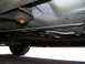 1999 Ford Crown Victoria - Underbody view of a 1999 Ford Crown Victoria, showing suspension and exhaust system components.
