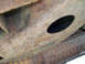 1999 Ford Crown Victoria - Close-up view of heavily rusted vehicle frame and underbody parts, with a SuperMotors logo visible.