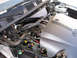 1999 Ford Crown Victoria - Engine bay view of a 1999 Ford Crown Victoria, showing the V8 engine components and SuperMotors branding.