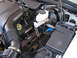 1999 Ford Crown Victoria - Close-up view of the engine bay components, including the air intake and brake system.
