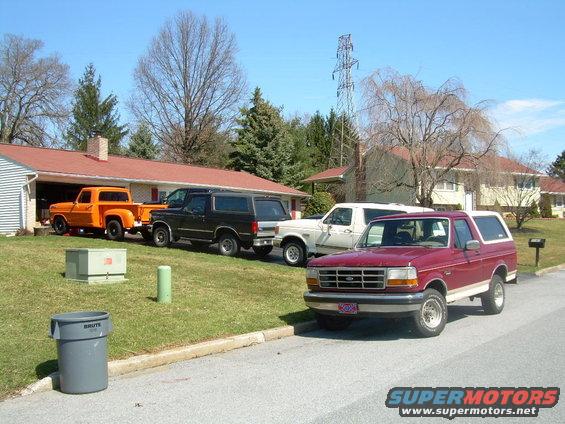 Red 1992 Ford Bronco 3q-front view parked on street