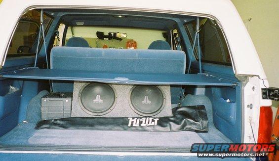 1996 Ford Bronco interior cargo area with dual JL Audio subwoofers and a Hi-Fidelity cover