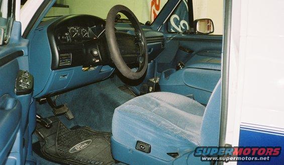 Interior shot of a 1996 Ford Bronco, showing the driver's seat, dashboard, and steering wheel