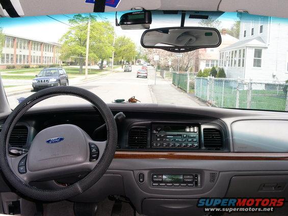 Interior view of a 2001 Ford Crown Victoria dashboard with Ford logo on steering wheel