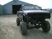 2001 Dodge 2500 - Pickup truck with significant modifications, including a lift kit and removed front end.