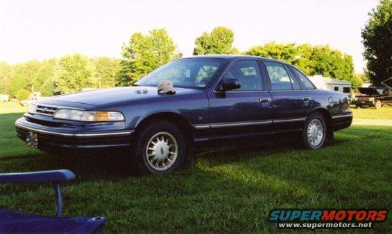1996 Ford Crown Victoria parked on grass, front quarter view