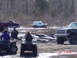 1995 Dodge 1500 - Several vehicles, including ATVs and trucks, are engaged in mud bogging activities in a wooded area.