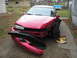 1995 Ford Thunderbird - A red sedan sits in a driveway with significant damage to its front end and a detached bumper.