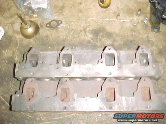 Top - C8AE 6090-J was a 14 bolt head originally has been drilled for additional holes to achieve 16 bolt pattern

Bottom C8AE-H 8 bolt pattern