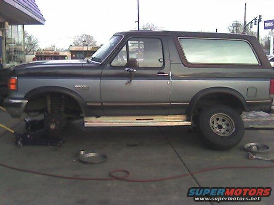 Bye, bye old tires!  One of the new ones are on the back here.  Since I haven't done a lift or anything, these are my temporary tires for daily driving.  Once a lift goes on (need a stepladder to get in) then the offroad puppies are going on!