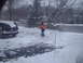 1996 Ford Probe - A black Jeep Grand Cherokee sits in a snow-covered driveway on a winter day.