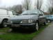 1988 Ford Sport - A 1988 Ford Sierra is parked on the grass, with a white van and a blue car visible in the background.