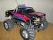 1988 Ford Bronco - This remote control truck features oversized tires and custom graphics, resembling a modified pickup.