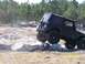 1989 Ford Bronco - A black Jeep Wrangler navigates a challenging obstacle course during an event in 2007.
