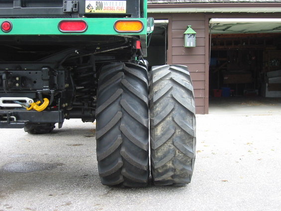 Rear tires of a truck, one larger than the other. Bio Diesel Fuel sticker visible