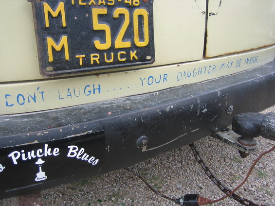 Rear bumper with Texas license plate and "Don't Laugh... Your Daughter May Be Inside" text