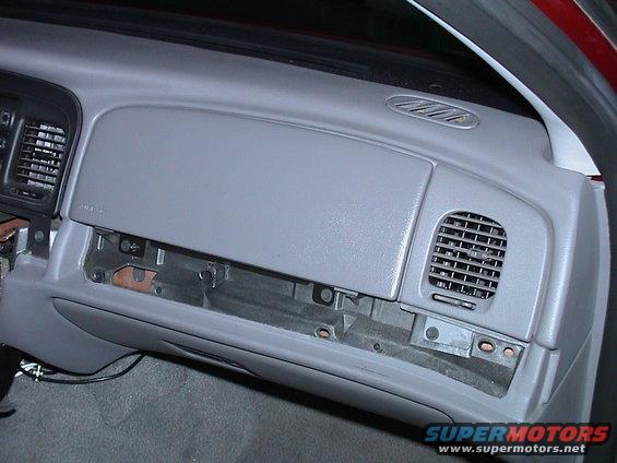 2000 Ford Crown Victoria dashboard with glove box open, showing interior components and air vents