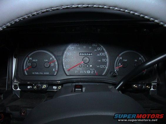 Dashboard gauges of a 2000 Ford Crown Victoria showing odometer reading 065290