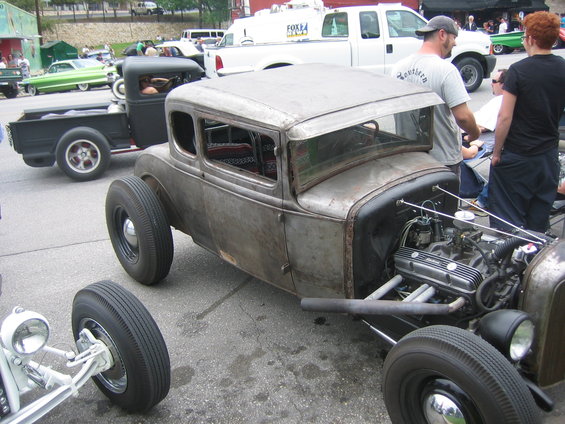 Rat rod coupe with exposed engine and custom wheels