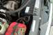 1988 Ford Bronco - Close-up view of a vehicle's engine bay, showing the battery and radiator components.