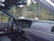 2004 Ford Crown Victoria - The interior of a 2004 Ford Crown Victoria is visible from the driver's perspective.