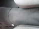 2004 Ford Crown Victoria - Interior view of a car's floor, showing carpet and a visible wire.