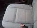 2004 Ford Crown Victoria - Close-up of a car's fabric seat and seatbelt buckle.