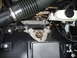 2004 Ford Crown Victoria - This image shows a section of a vehicle's engine bay, focusing on the brake fluid reservoir and air intake system.