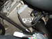 2004 Ford Crown Victoria - Close-up of an engine component with a label and electrical connectors visible.