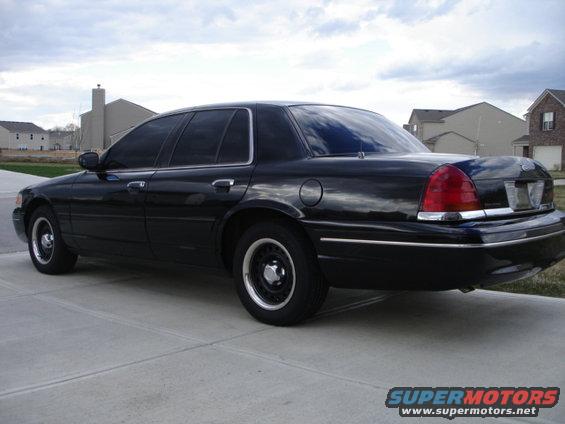 Black 2001 Ford Crown Victoria parked on a driveway