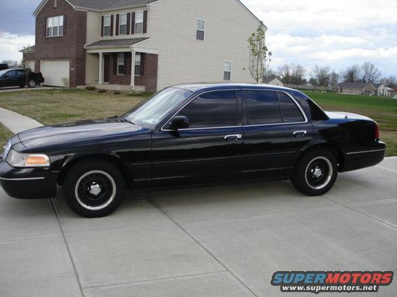 Black 2001 Ford Crown Victoria sedan, side view