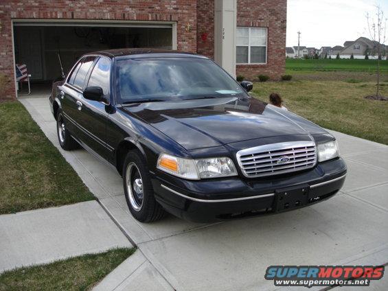 Black 2001 Ford Crown Victoria parked in driveway