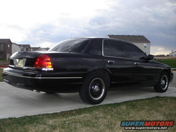Black 2001 Ford Crown Victoria rear 3/4 view