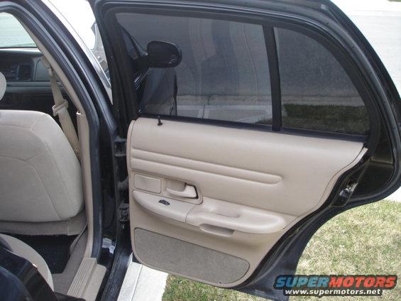 2001 Ford Crown Victoria interior door panel and tan seat