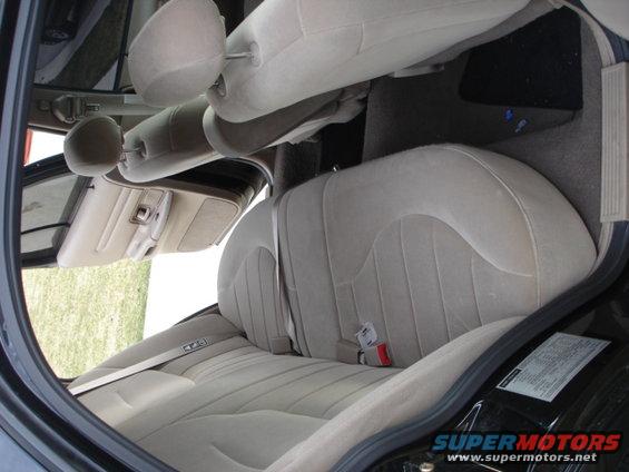 2001 Ford Crown Victoria interior showing tan cloth seats and door panel
