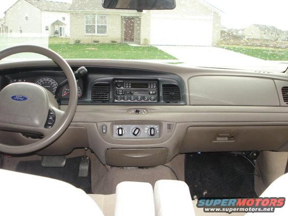 2001 Ford Crown Victoria interior showing dashboard, steering wheel, and radio