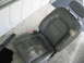 1995 Ford Thunderbird - A worn leather car seat with visible damage is placed on a concrete surface.
