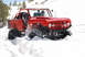 1989 Ford Bronco - This red off-road vehicle navigates a snowy terrain, kicking up snow as it drives.