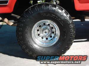 1986 Ford Bronco front wheel with polished aluminum rim and BFGoodrich Radial All-Terrain T/A tire. Red fender visible