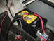 1985 Ford Crown Victoria LTD - Close-up view of a car battery and its associated wiring, along with some fuel system components.