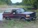 1996 Ford Bronco - This 1996 Ford Bronco is stuck in the mud near a body of water.