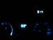 1995 Ford Thunderbird - The illuminated dashboard displays the time and temperature, along with various climate control settings.