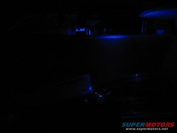 1995 Ford Thunderbird interior with blue ambient lighting under the dashboard